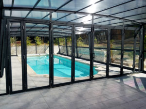 Pool cover enclosure with doors