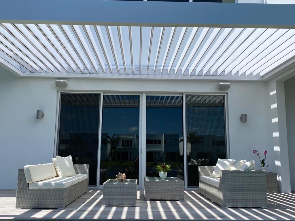 Pergola with motorized louvered roof