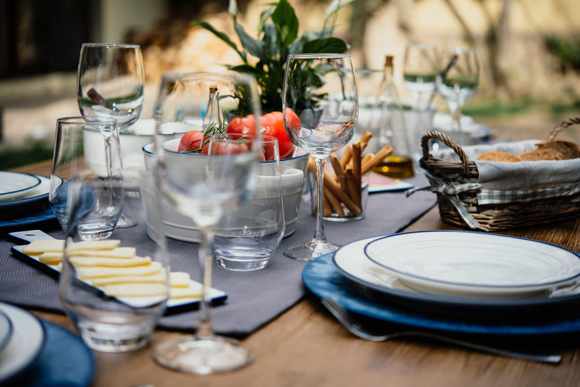 Table ready for diner outdoors covered rood kitchen