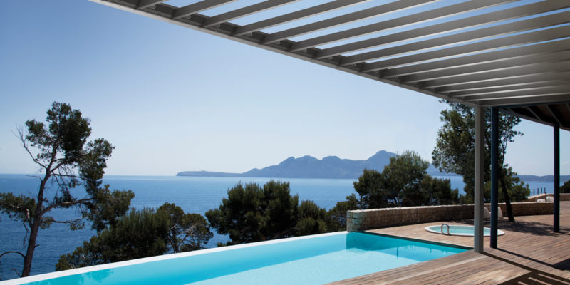 pool deck with modern louvered pergola