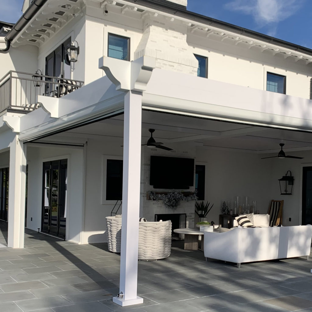 backyard with louvered roof pergola