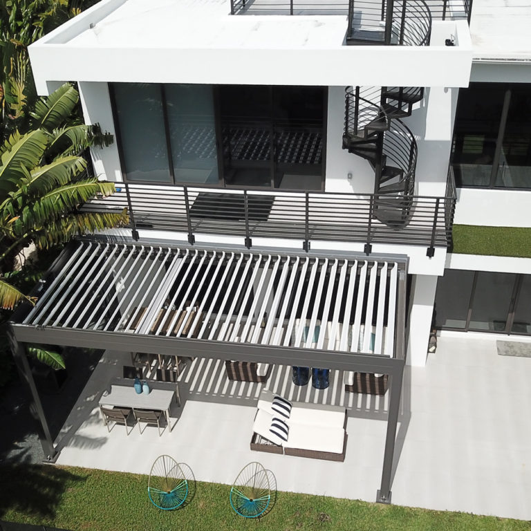 covered extension with motirized louvered roof pergola