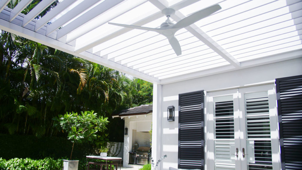 motorized roof with dual-wall louvers