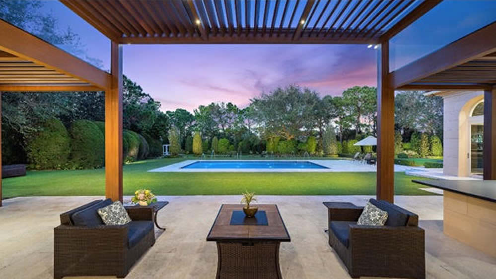 Outdoor living room covered with luxury louvered pergola