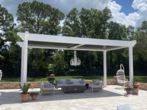 standalone louvered pergoal in white with motorized roof