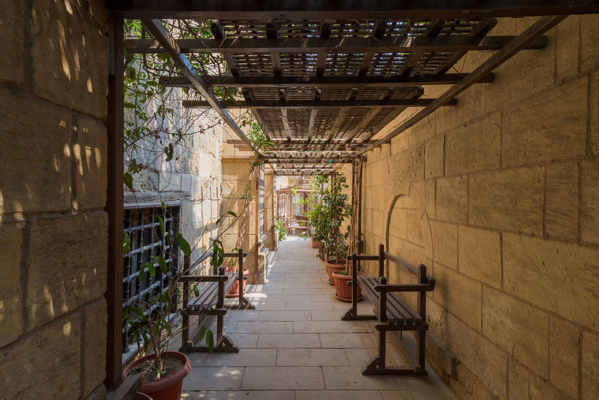 wooden pergola leading to historic from Maml