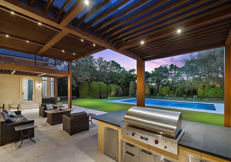 Modern pergola design with outdoor kitchen area