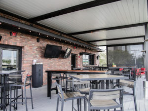 World of beer covered deck with louvered roof pergola