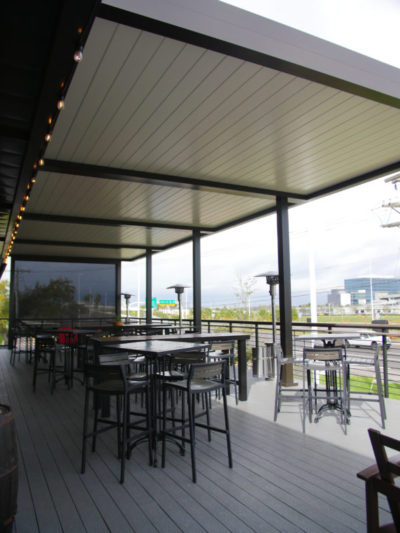 Louvered roof system to cover outdoor terrace for restaurants and bars