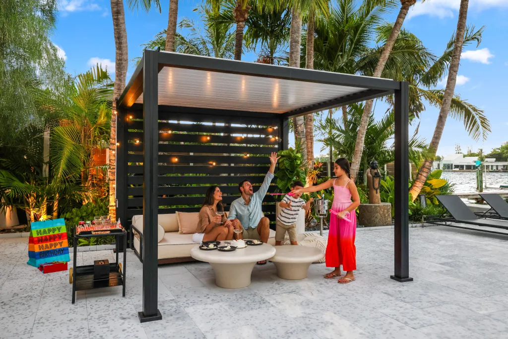 A family enjoying themselves in their backyard under a k-bana