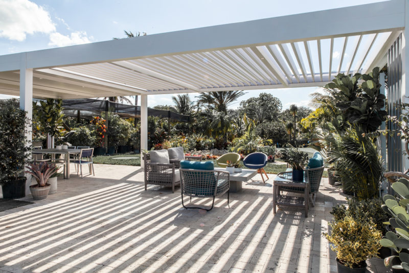 patio design with louvered pergola in white