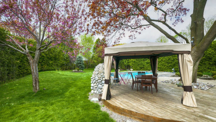 Backyard wooden deck with fabric canopy