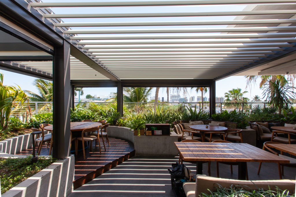 Outdoor dining on a rooftop, Miami Beach, FL