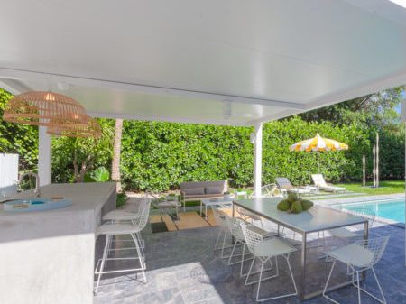 pool deck with freestanding pergola in white