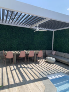 white structure and bronze louvers for beach house pergola
