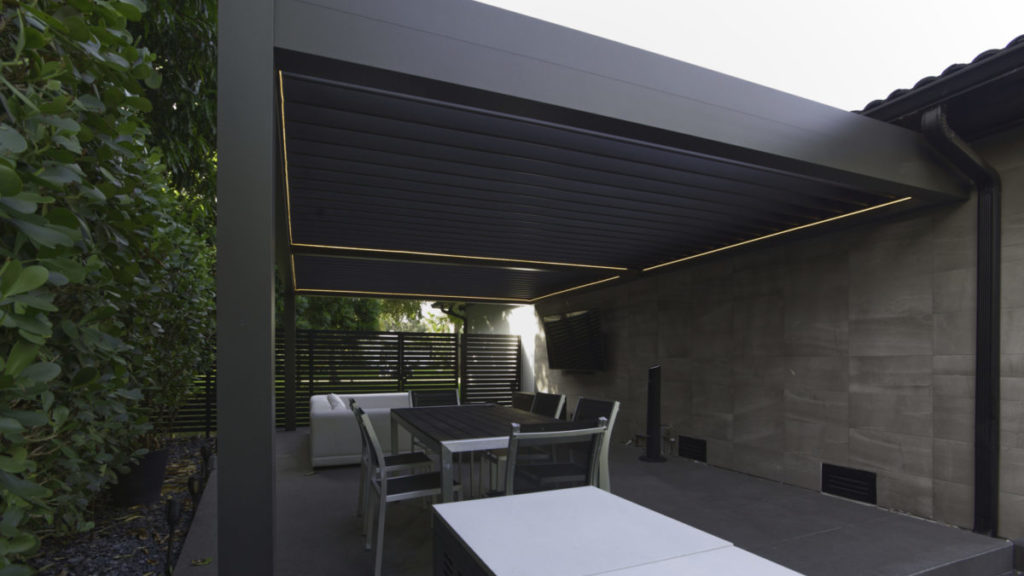 R-Blade pergola by Azenco near neighbor's fence