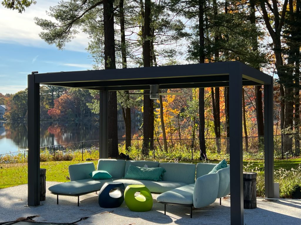 Lake house with pergola covers for winter with cozy decor
