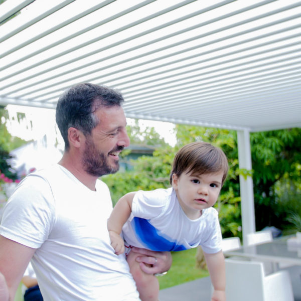 slatted pergola with motorized louvered roof