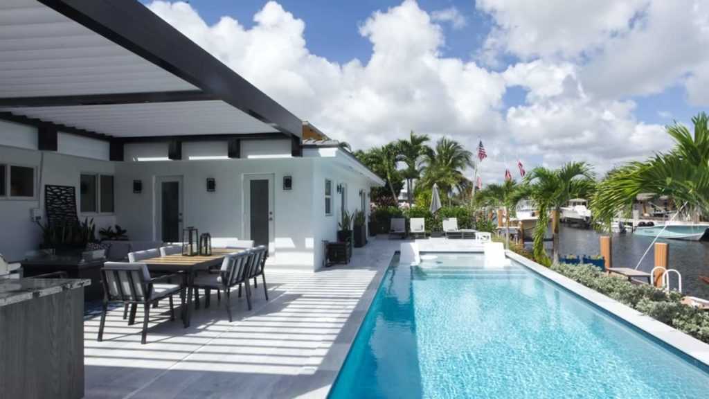 Pool view with pergola louvered roof