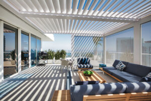 White aluminum pergola with louvered roof on a rooftop in Miami - By Azenco