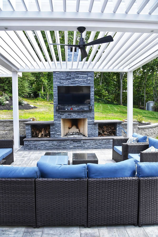 Outdoor living room covered by custom R-Blade pergola - Azenco installed by Gary Duff Designs