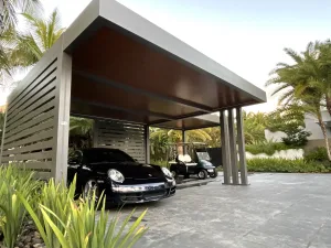 Azenco custom carport for luxury cars and golf carts, featuring bronze frame and wood grain finish insulated roof - Azenco outdoor