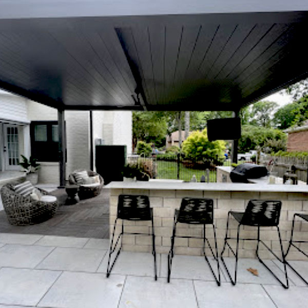 Outdoor bar setup with black pergola patio cover.