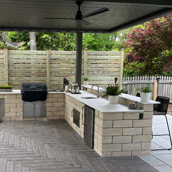 Outdoor kitchen setup with pergola cover in black, by Azenco in Virginia