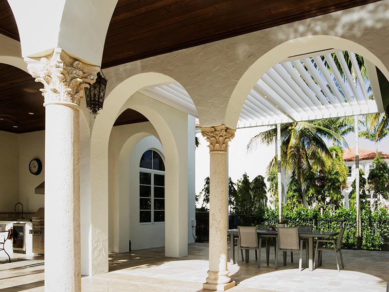 Mediterranean patio with arcades and automated louvered roof by Azenco