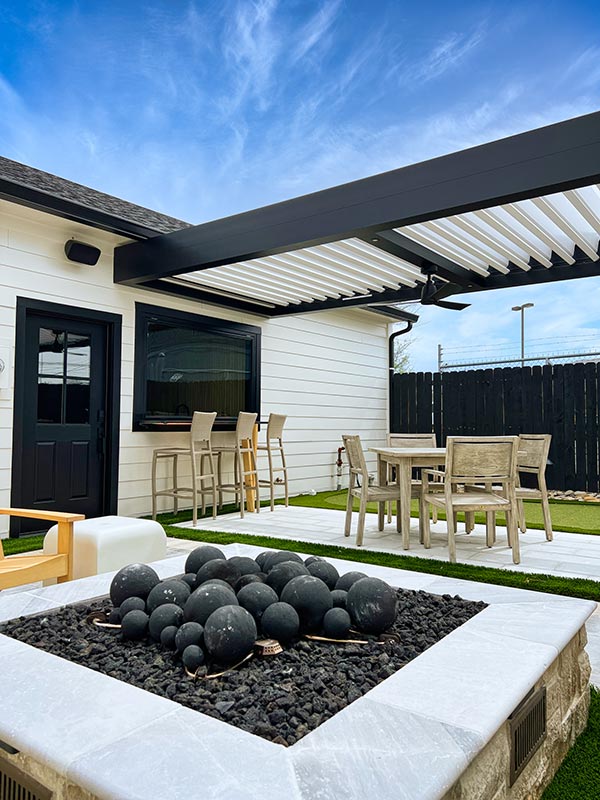 R-Blade louvered pergola covered courtyard