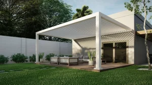 Custom white aluminum pergola with 55 degrees fixed angled slats taht is attached to the wall. Model R-Breeze by Azenco Outdoor