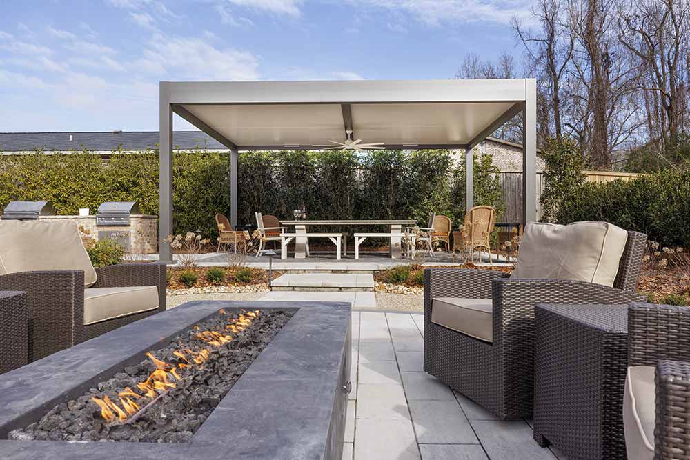 Residential outdoor project with a patio cover and a firepit in Alabama - Azenco Outdoor