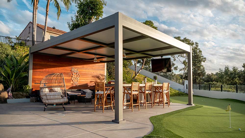 Outdoor transformation with a custom free standing solid roof aluminum pergola by Azenco Outdoor