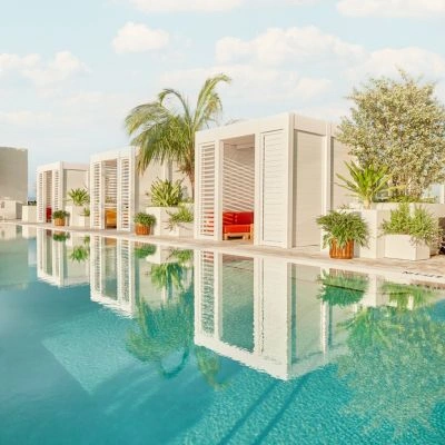 Custom crafted cabana design in full white on a hotel rooftop pool deck - Azenco Outdoor