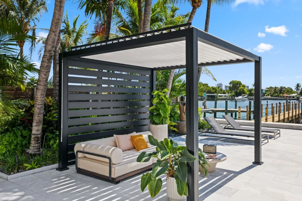 This K-Bana pergola provides shade, shelter, and elegance to this luxury backyard by the pool.