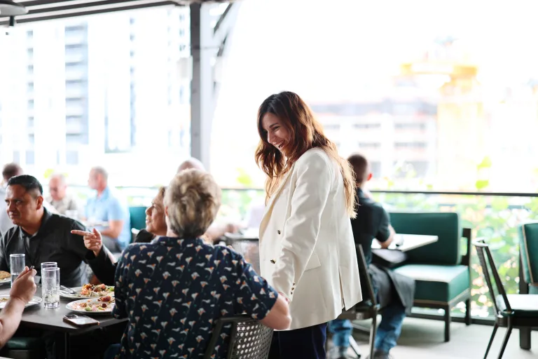 Leslie speaking to a dealer during lunch