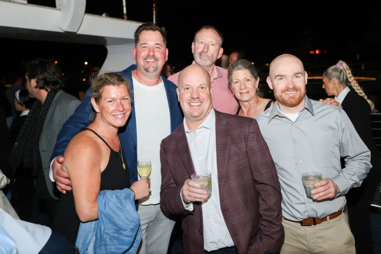 a group of dealers posing for a photo