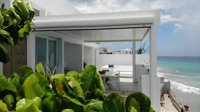 white r-shade attached to a beachside house