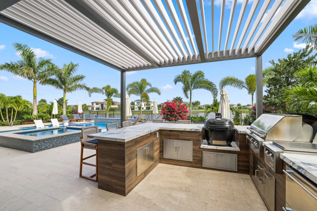 outdoor kitchen pergola r-blade attached to a house in backyard