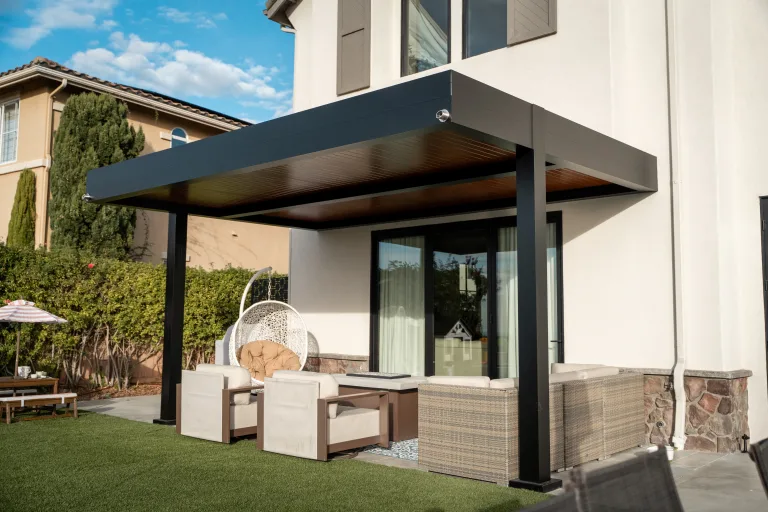 gray bronze r-shade attached to a house with backyard furniture