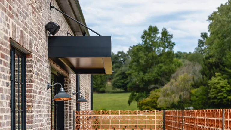 black insulated awning k-nopy in yard