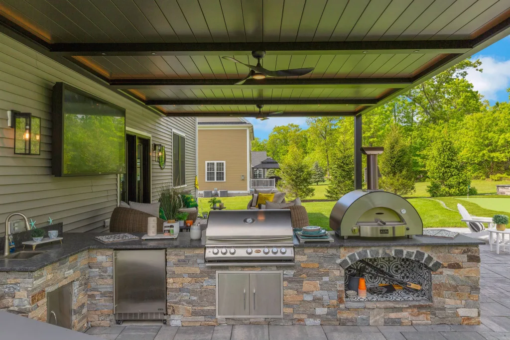 black r-blade attached to house in backyard