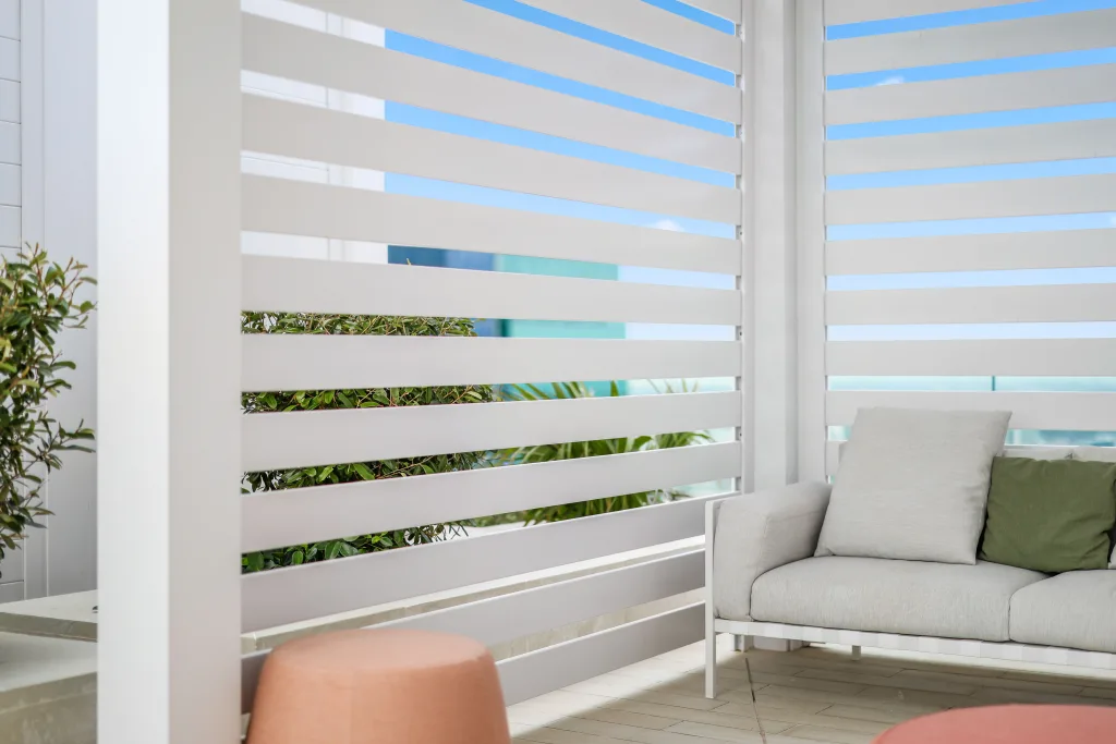 custom white r-blade poolside with privacy walls