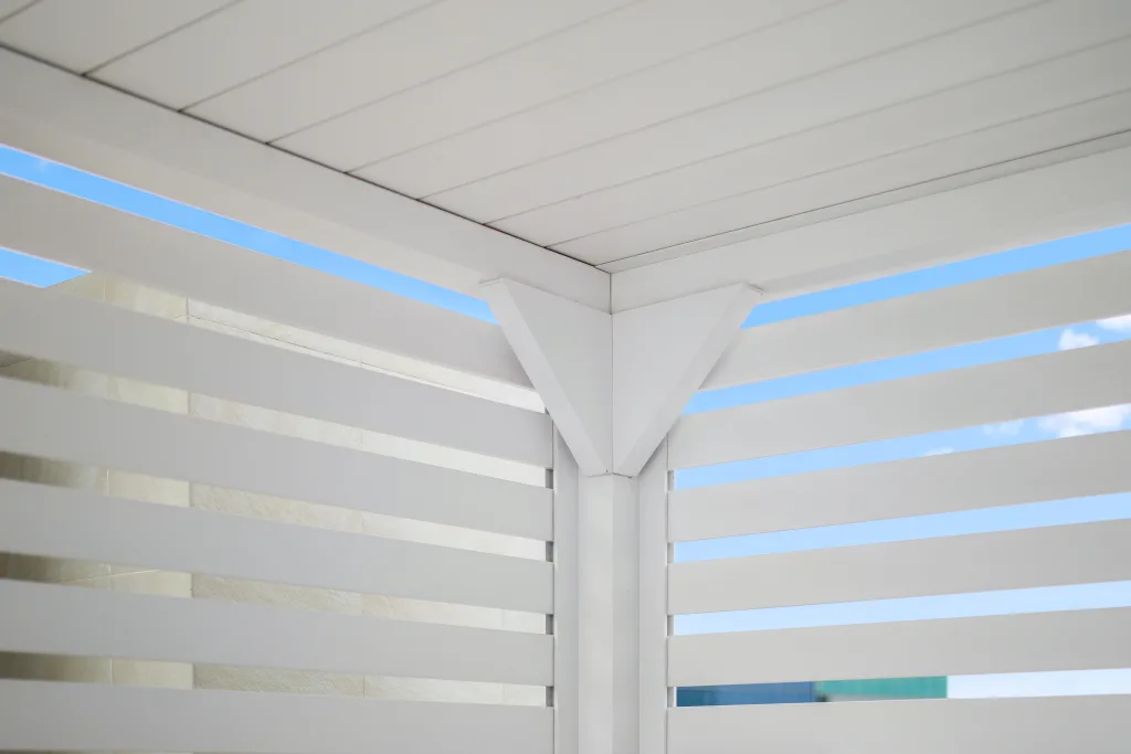 custom white r-blade poolside with privacy walls