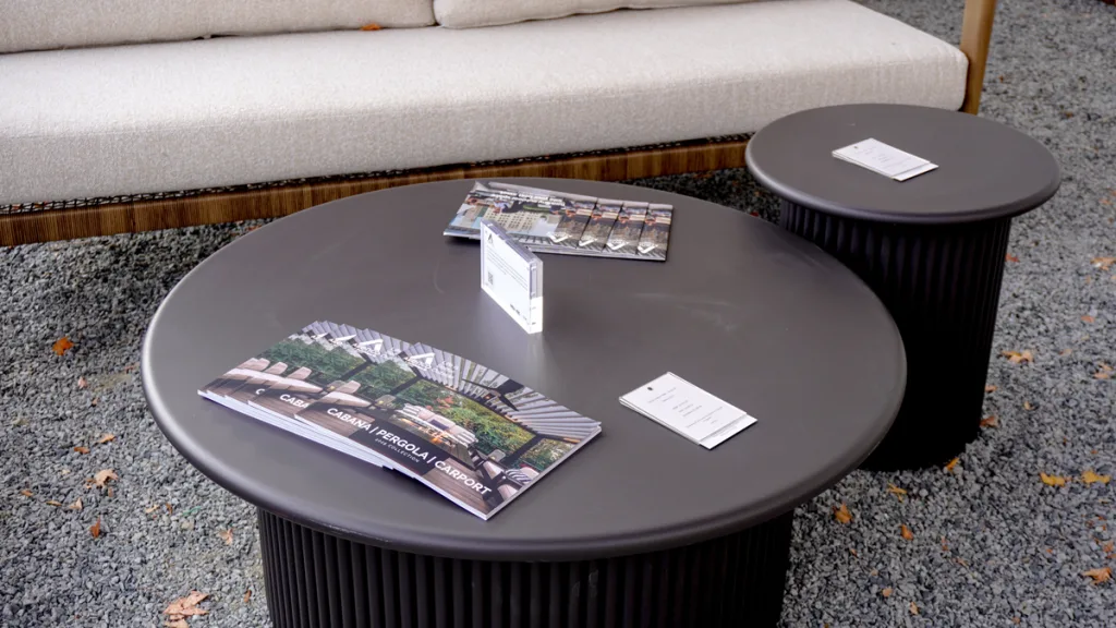 Interior signage at Broad Hall listing event sponsors and floor directories. The glossy panels display the logos of NKBA KBIS, Cosentino, and various partners, including the Azenco logo, highlighting the collaboration at the High Point Market 2025 debut.