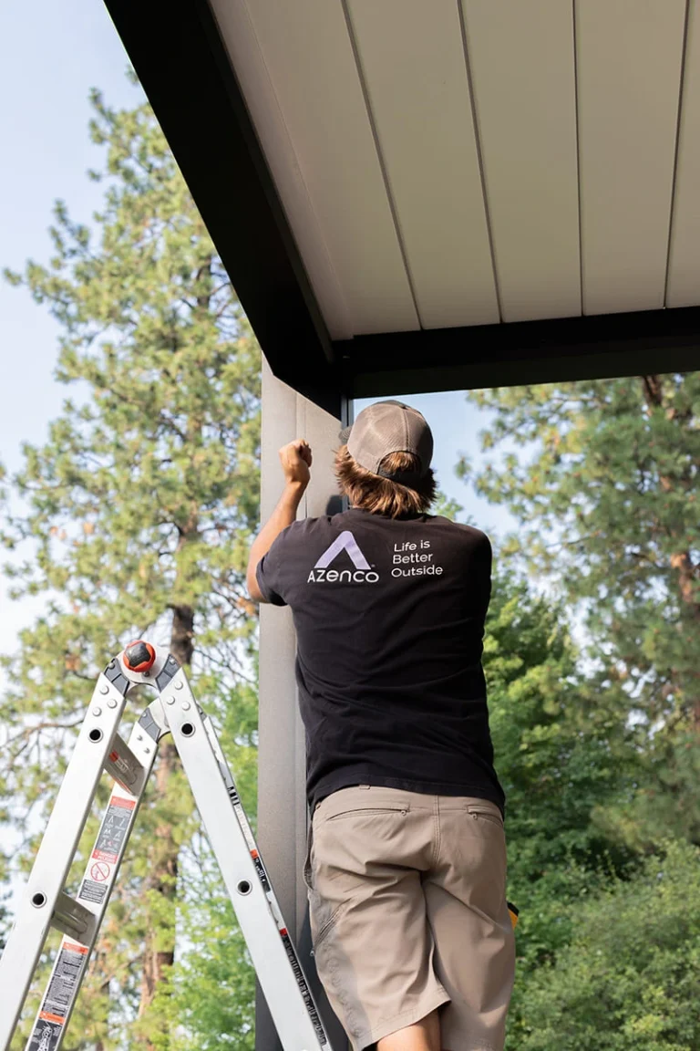 Certified Azenco Outdoor installer assembling a pergola on site