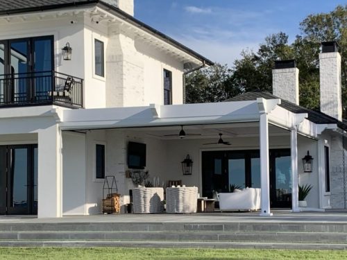 wall mounted motorized louvered roof pergola in white