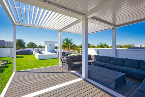 Multiple K-BANA modules for a covered residential area on a rooftop terrace: K-BANA aluminum manual louvered roof by Azenco