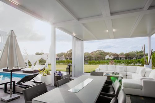 outdoor covered space with fixed roof pergola in white