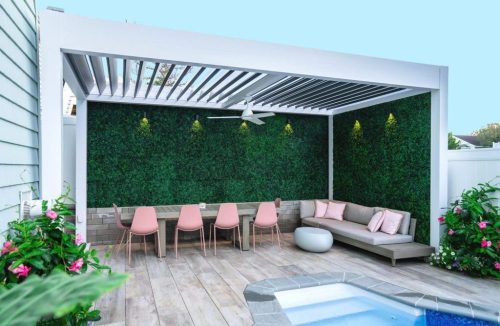 small backyard with louvered pergola